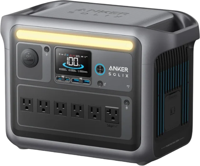 A compact portable power station with household outlets, USB ports, and a display